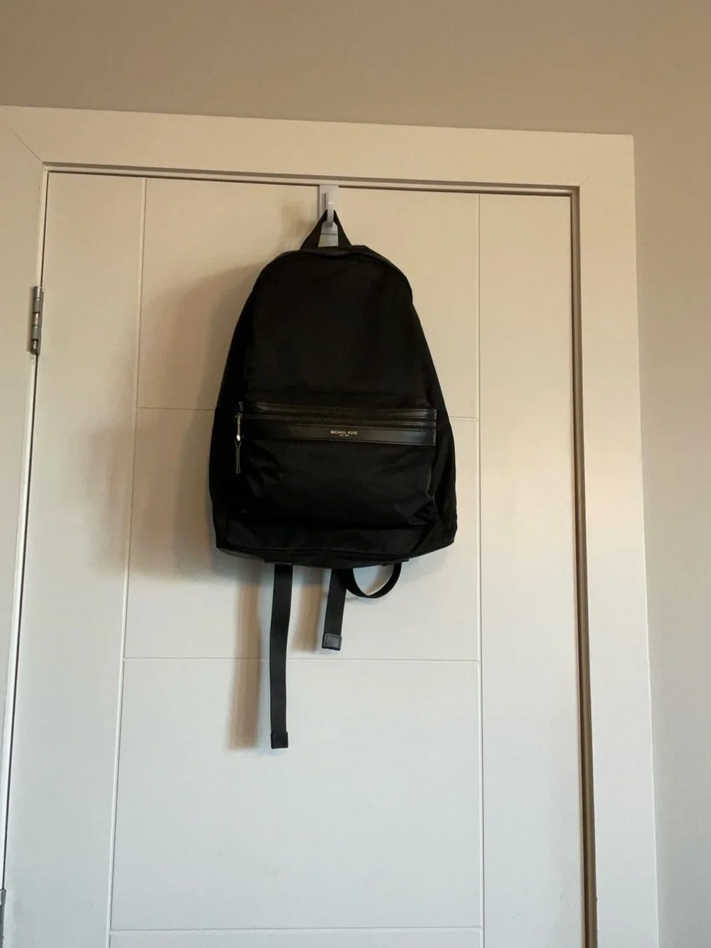 Black Michael Kors Kent Backpack. Silver hardware